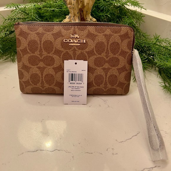 Coach Handbags - Coach Signature Tan Wristlet Clutch